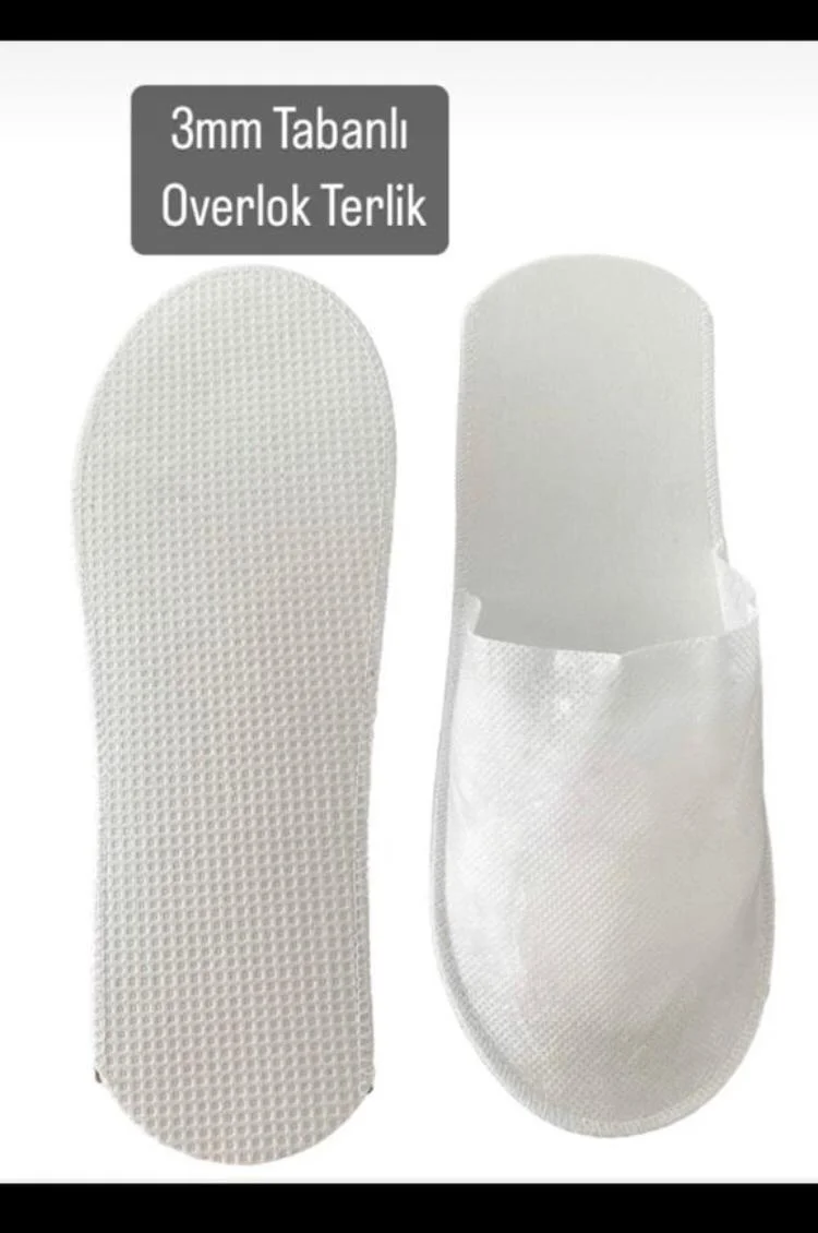 Beyaz renkli tek kullanımlık terliğin taban ve üst görünümü